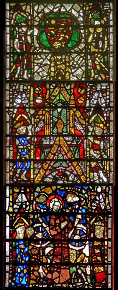 Window w42 depicting St Catherine being tortured: above is a royal coat of arms by English School