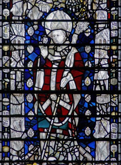Window depicting St Nicholas; border with figures by English School