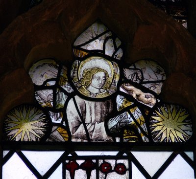 Window w6 depicting an angel and Edward IV sun-bursts by English School