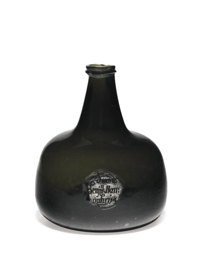 Wine bottle of mallet form with string rim and kick-in base by English School