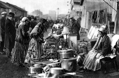 A view of the flea market at the entrance of St Ouen, Paris by Ernest Flammarion