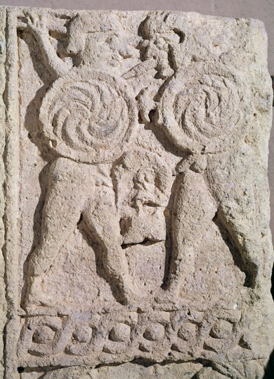 Detail of a tombstone with two warriors by Etruscan