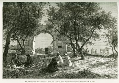 Bab-er-Roumia (Bab er Roumia), gate of the Christian woman, Roman ruins in Dougga, picnic of travelers and their guides, around a camera. Engraving by Eugene Girardet, to illustrate the story 