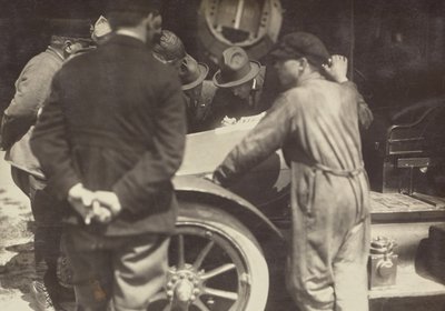Men Grouped Around the Hood of a Car by Fedele Azari