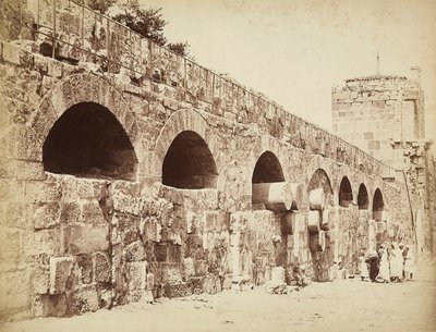 View of the City Walls of Heliopolis or Baalbek, Ancient Syrian City, Now Lebanon. A Group of People are Gathered Together Close to the Wall by Félix Bonfils