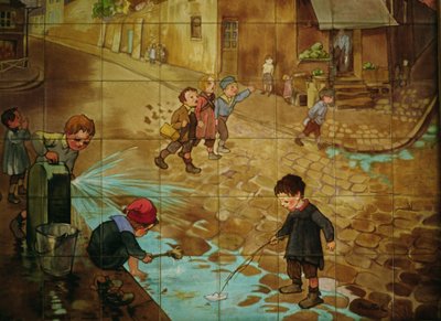Tiles depicting children playing in the street by Francisque Poulbot
