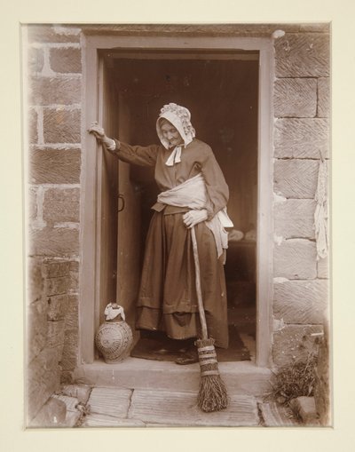 An Old Lady with a Yeast Bottle at a Cottage Door by Frank Meadow Sutcliffe