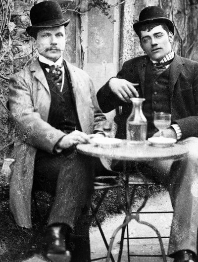 A chatelain (Ducos) and his coachman sitting on the terrace of a café and drinking absinthe - photograph, circa 1890 by French Photographer