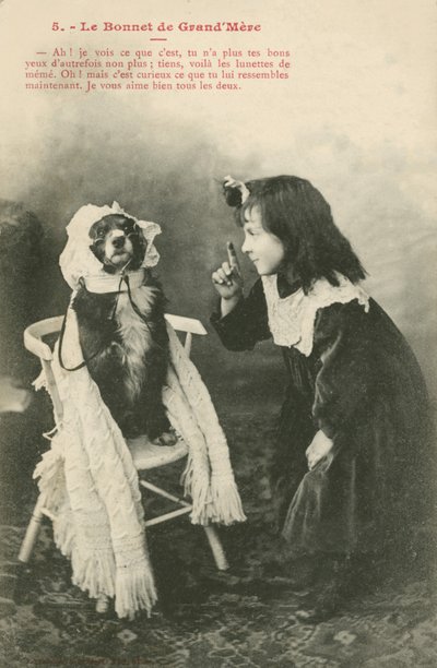 Child Dressing Her Dog in a Bonnet by French Photographer