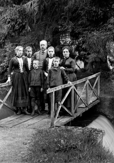 Family of Urban Dwellers Posing in Their Garden by French Photographer