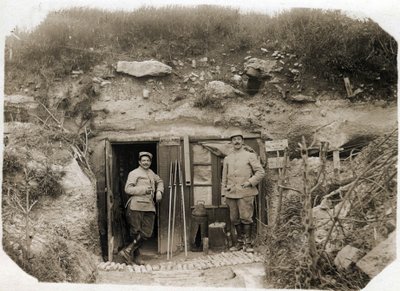 First World War: the command post of Lieutenant De Benedetti, the secretary on the left, the battalion warrant officer on the right. Between them, signal flares, periscope, torpedoes. May 1916 by French Photographer