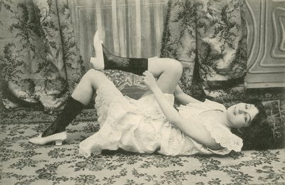 Girl pulling up her socks by French Photographer