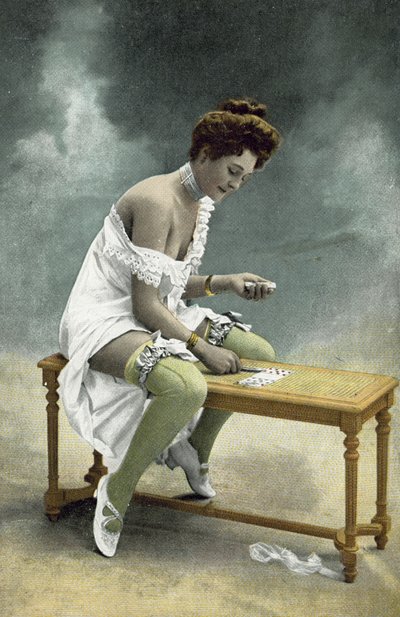 Girl with Exposed Stockings and Breast Playing Patience on Wooden Stool by French Photographer