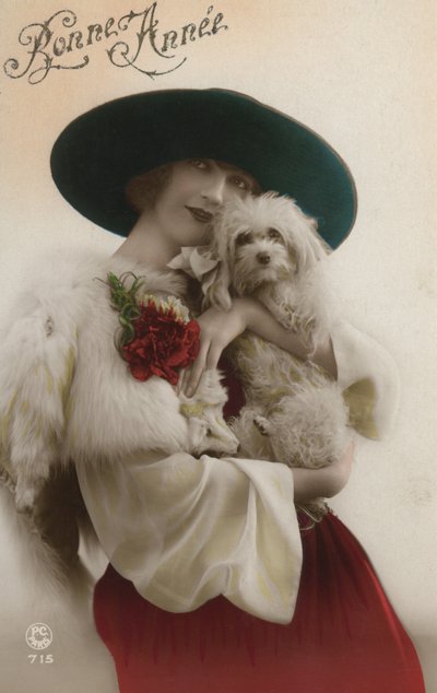 Lady holding a small dog by French Photographer