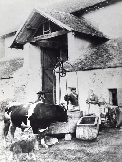 Peasants around a well, in a farmyard by French Photographer