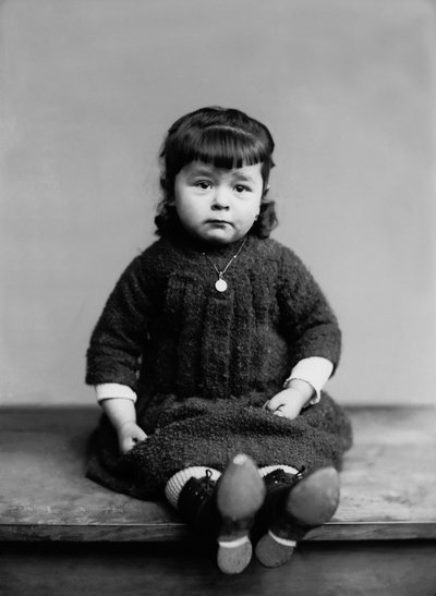 Portrait of a Little Girl from Bourmont in Haute Marne, with Her Baptism Medal. Photography Late 19th Century. Ducos Collection by French Photographer