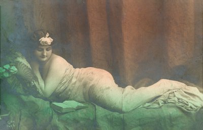 Reclining girl, reading by French Photographer