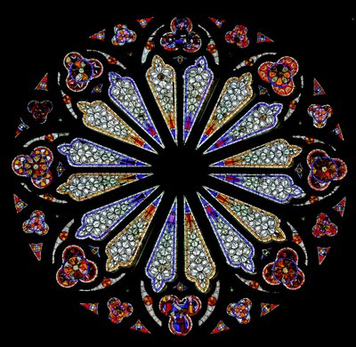 A late 13th century rose window with some original glass by French School