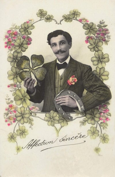 A man with a four-leaf clover and a horseshoe by French School