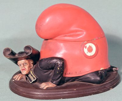 An inkwell or tobacco pot in the form of a priest crushed by a phrygian bonnet by French School