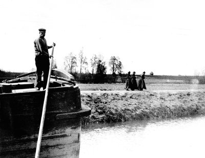 Barge being towed on a canal by three women by French School