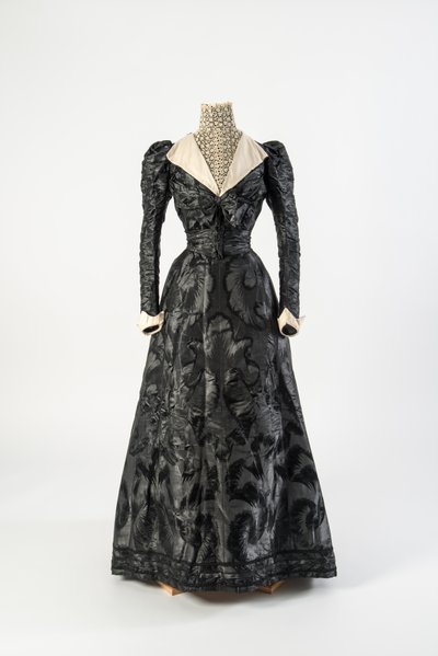 Black Figured Silk Dress with High Neck Chemisette of Cream Lace, Early 1890s by French School