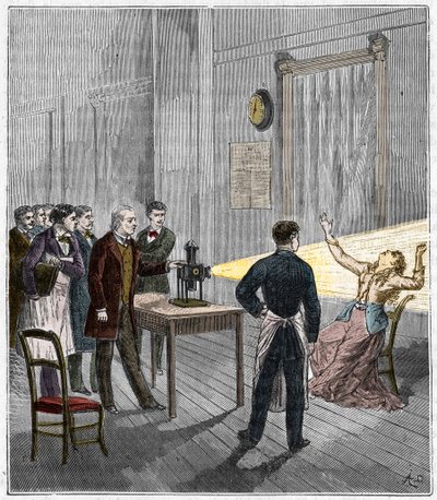 Catalepsy produced under the influence of light - The French neurologist Jean Martin Charcot (1825-1893) studying the phenomenon of hypnosis on a patient at Salpetriere hospital using a magic lantern by French School