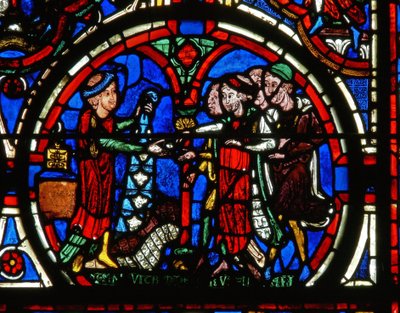 Detail from a window depicting the Passion: donors and the furriers by French School