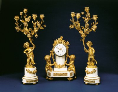 Garniture retailed by Black, Starr and Frost comprising a mantel clock and pair of four-light candelabra, c.1875-1900 by French School