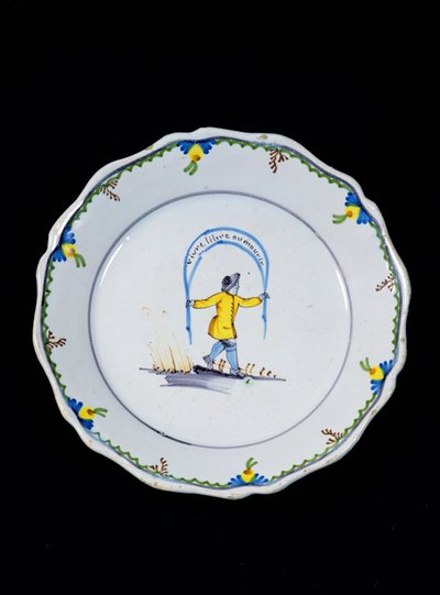Plate Decorated with a Person Holding a 