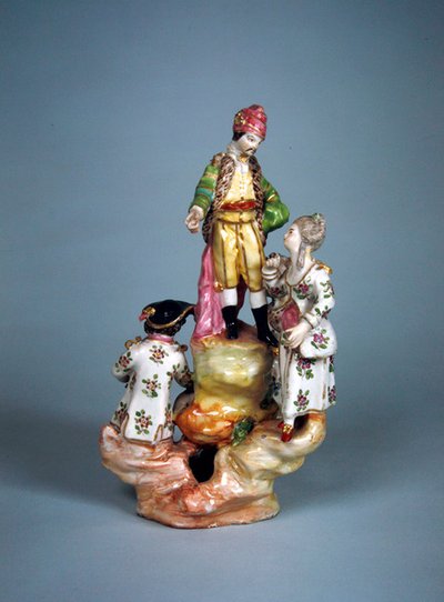 Statuette of four persons grouped on a rockery by French School