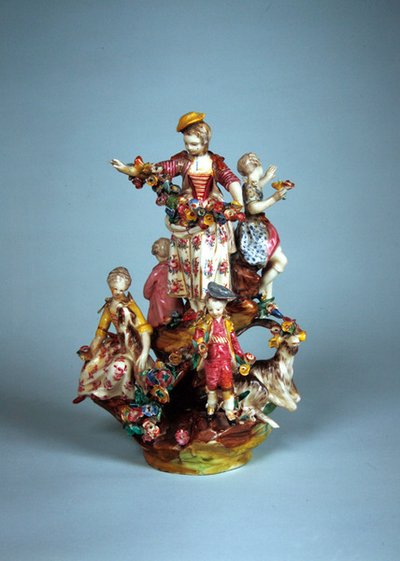 Statuette of women and children grouped on a rockery by French School