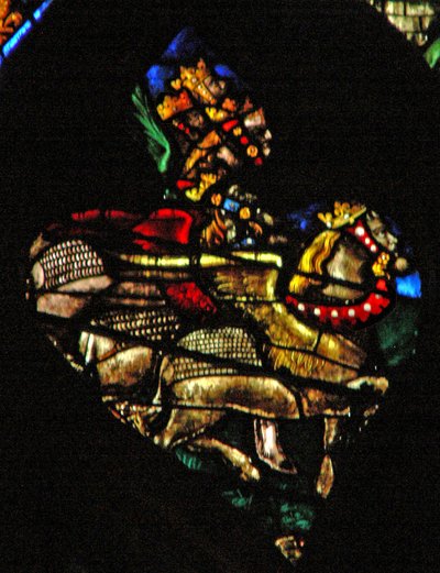 The west rose window depicting a scene from the Book of Revelation: Locusts as horses prepared for battle, with heads like men, hair like women and tails like scorpions by French School