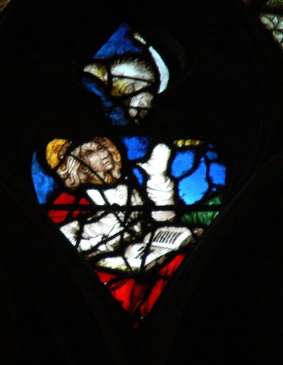 The west rose window depicting a scene from the Book of Revelation: Opening of the fourth seal, with the eagle of St John by French School
