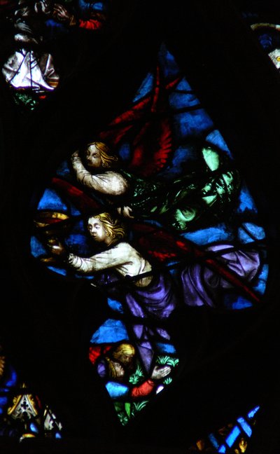 The west rose window depicting a scene from the Book of Revelation: Two angels, one announcing Babylon is fallen, the other carrying the wine of the wrath of God by French School