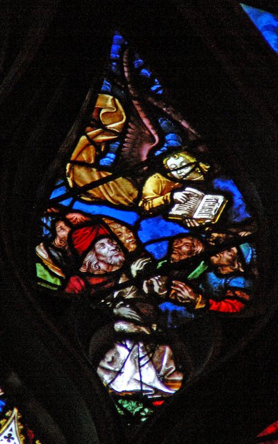 The west rose window depicting a scene from the Book of Revelation: Angel announces the hour of judgment by French School