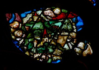 The west rose window depicting a scene from the Book of Revelation: Angels holding back the wind from the land and the ships of the sea by French School