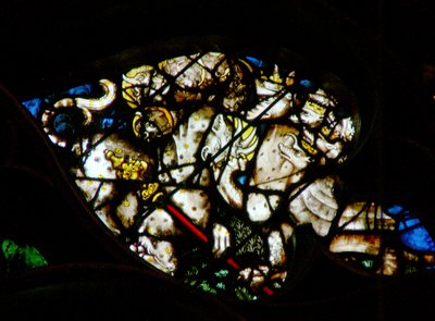 The west rose window depicting a scene from the Book of Revelation: Dragon gives power and authority to the beast by French School