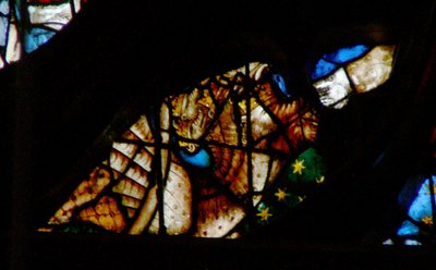 The west rose window depicting a scene from the Book of Revelation: Dragon with seven heads and ten horns and a third part of the stars by French School