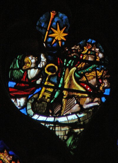 The west rose window depicting a scene from the Book of Revelation: Fifth trumpet; the star falls from heaven, the key to the bottomless pit, and a huge locust by French School
