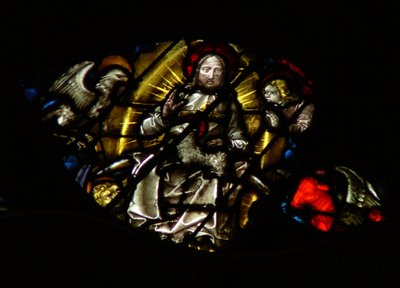 The west rose window depicting a scene from the Book of Revelation: Lamb before the throne, between the four sacred living creatures by French School