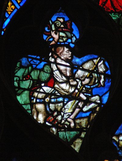 The west rose window depicting a scene from the Book of Revelation: Pale horse with the grotesque figure of Death, armed with a javelin and vipers by French School