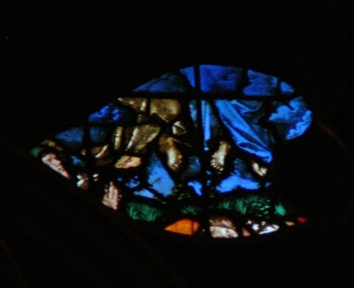 The west rose window depicting a scene from the Book of Revelation: Resurrection of the witnesses and their ascension whilst the lookers on are amazed by French School
