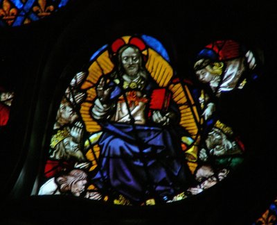 The west rose window depicting a scene from the Book of Revelation: Seventh trumpet; the elders prostrate themselves before the throne by French School