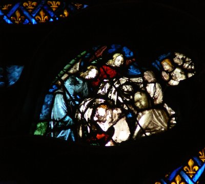The west rose window depicting a scene from the Book of Revelation: Souls being arrayed in white robes by angels by French School
