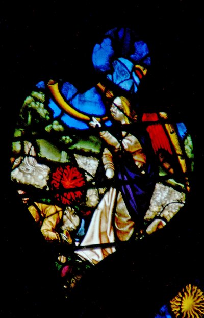 The west rose window depicting a scene from the Book of Revelation: Third trumpet; the star Wormwood falling onto the waters by French School