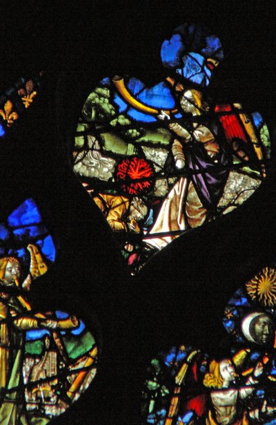 The west rose window depicting a scene from the Book of Revelation: Third trumpet; the star Wormwood falling onto the waters by French School