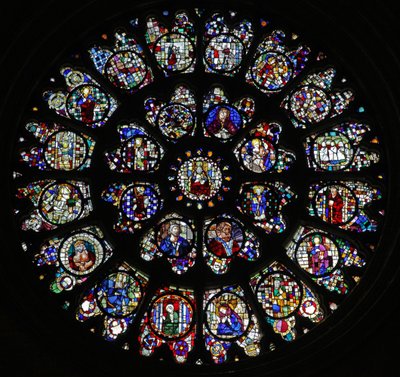 The west rose window with fragmentary fifteenth and sixteenth panels mostly depicting saints by French School