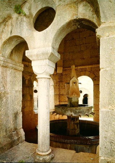 View of the water fountain used by the monks in the cloister by French School