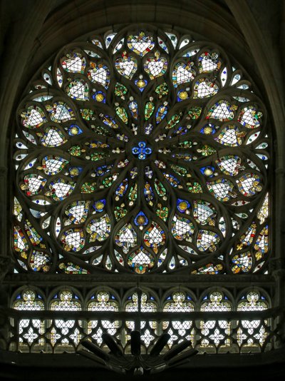 Window S rose depicting the south rose window, built in the early C16, contains much of its original decorative glass, though it was much restored in 1865 by French School